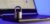 Locked metal padlock on a laptop keyboard over blue background. Cyber security, antivirus software concept.