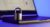 Locked metal padlock on a laptop keyboard over blue background. Cyber security, antivirus software concept.