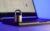 Locked metal padlock on a laptop keyboard over blue background. Cyber security, antivirus software concept.